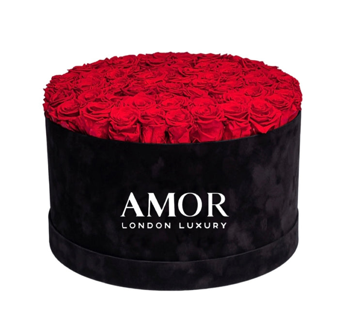 60-70 roses in a black round deluxe suede box.