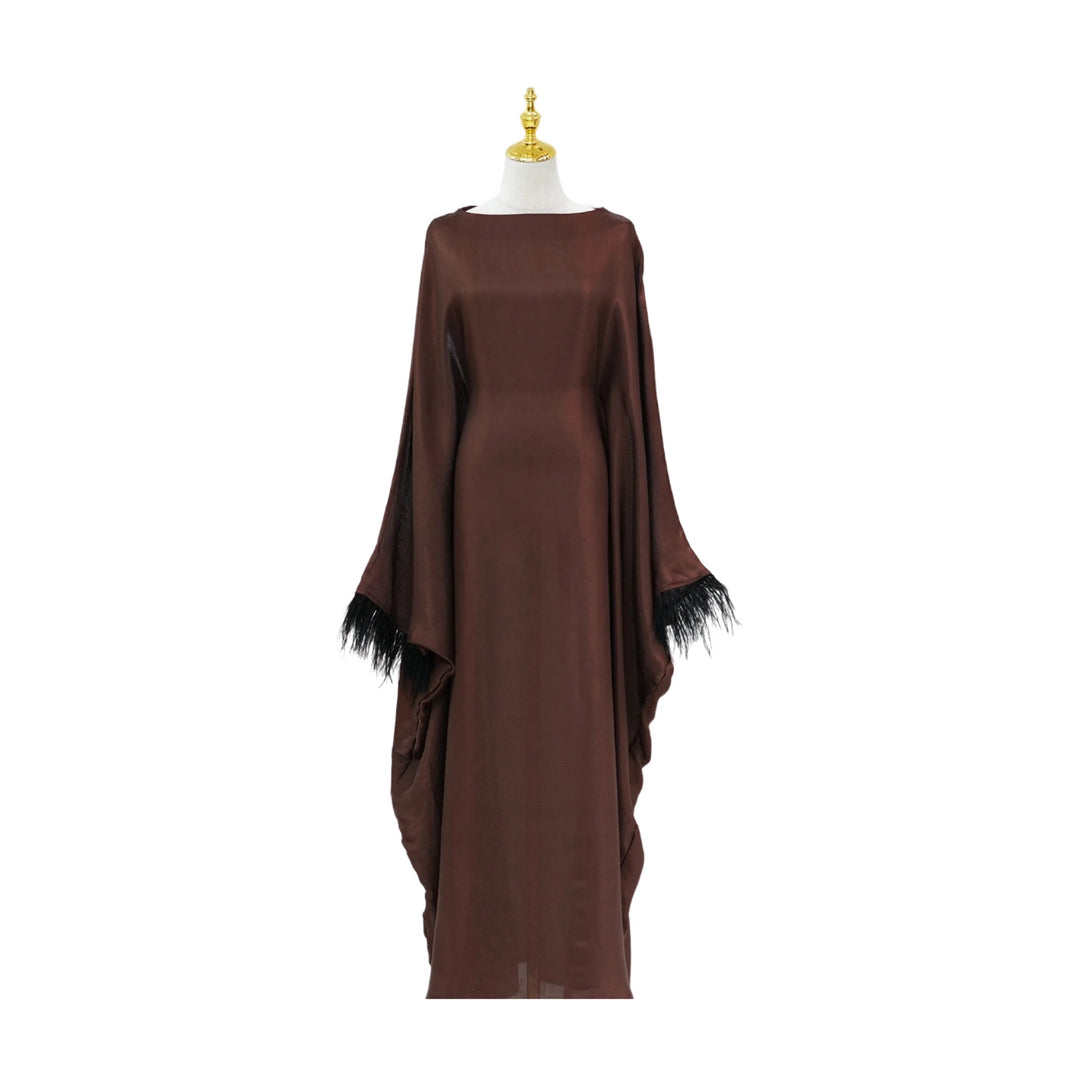 Shiny bat wing abaya with inner belt and feathers.